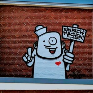 Die Bilder dokumentieren den Besuch des Künstlers von der Skizze bis zum fertigen Wandbild